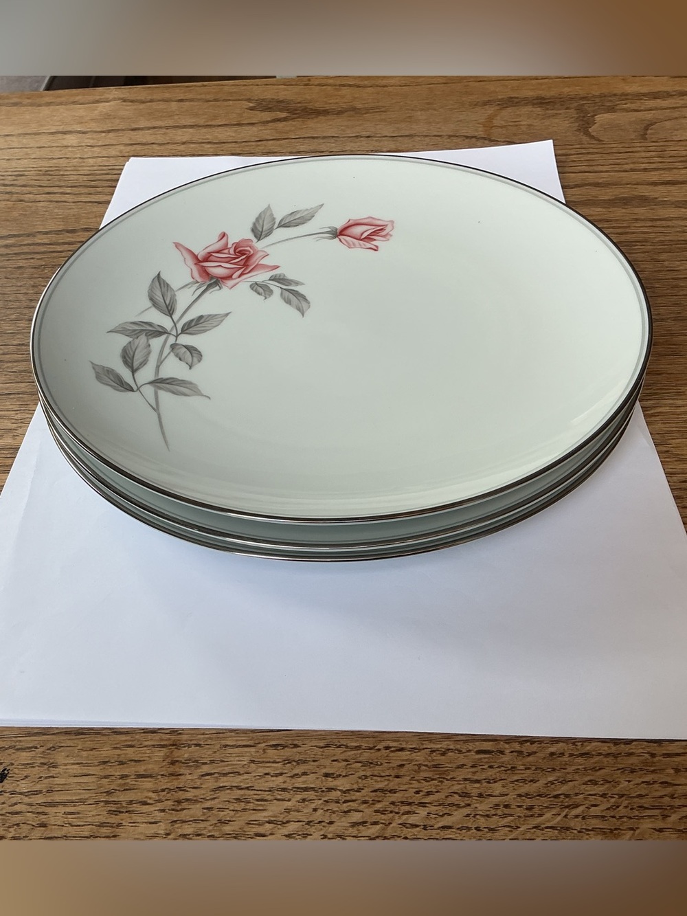 Set of three Noritake Rosemarie Dinner Plates, 10 1/2” round.
